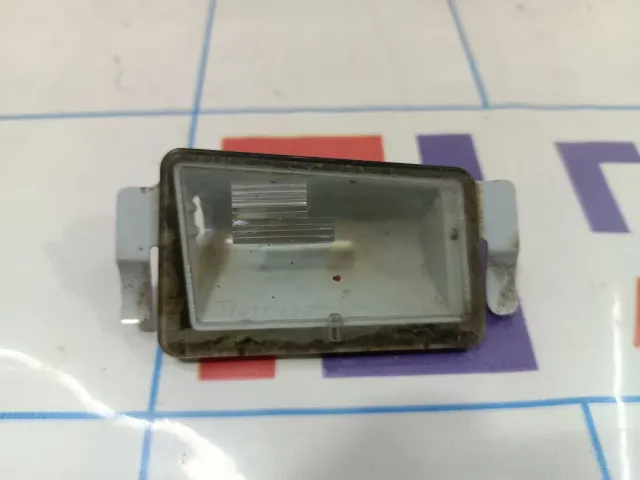 Фонарь подсветки номера правый Cadillac SRX