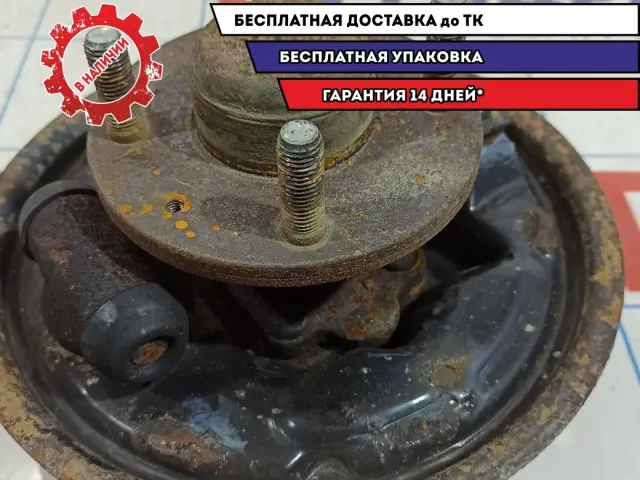 Щит опорный задний левый Chevrolet Aveo T250 96534696. Со ступицей.