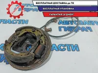 Щит опорный задний левый Chevrolet Aveo T250 96534696. В сборе с колодками и тросом стояночного тормоза.