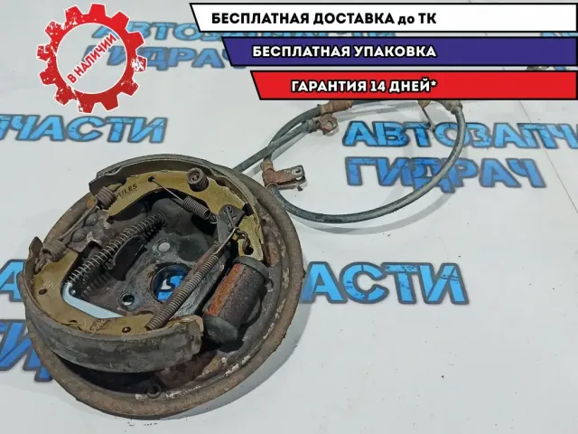 Щит опорный задний левый Chevrolet Aveo T250 96534696. В сборе с колодками и тросом стояночного тормоза.