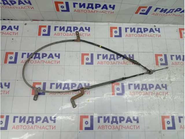 Трос ручника (Трос стояночного тормоза) Hyundai Elantra 597703X000
