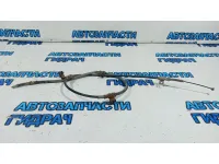 Трос стояночного тормоза левый Hyundai Grand Starex TQ-2 597604H300.