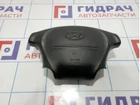 Подушка безопасности в рулевое колесо Hyundai Starex (A1) 569004A100LK