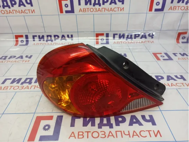 Фонарь задний левый Kia Spectra 0K2NC51160A. Дефект.