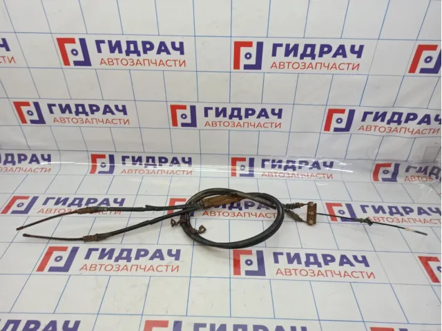Трос стояночного тормоза Kia Spectra . Комплект.