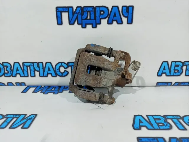Суппорт тормозной задний левый Kia Rio 3 58310-1RA30.