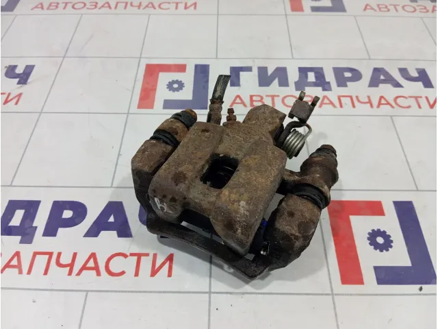 Суппорт тормозной задний левый Kia Carens 0K2FC26990