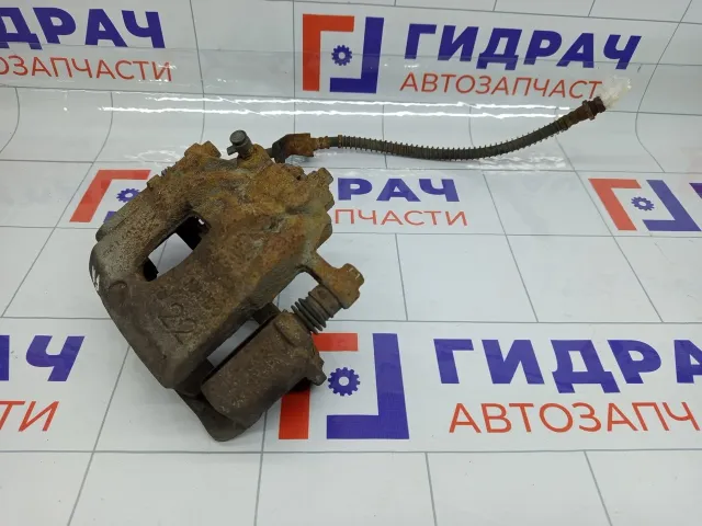 Суппорт тормозной передний правый Kia Rio 581304L000