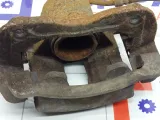 Суппорт тормозной передний правый Kia Rio 581304L000