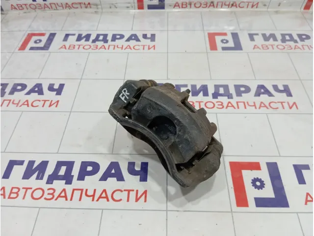 Суппорт тормозной передний правый Kia Rio 581304L000