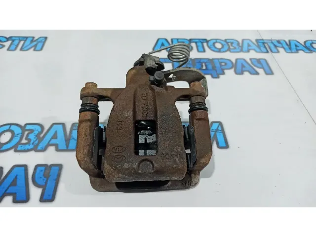 Суппорт тормозной задний правый Kia Rio 3 58400-1R300.