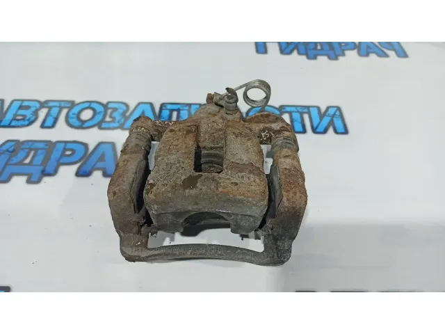 Суппорт тормозной задний правый Kia Rio 3 58400-1R300.