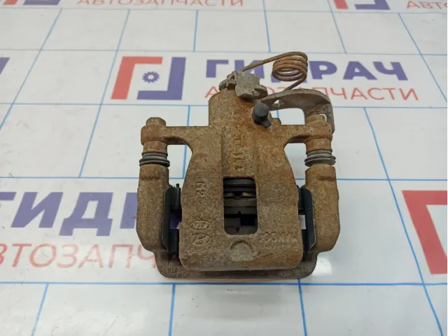 Суппорт тормозной задний правый Kia Rio 3 58400-1R300.