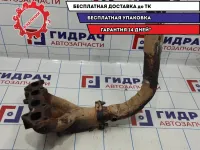 Коллектор выпускной Kia Spectra 0K30E13450C. С приемной трубой.