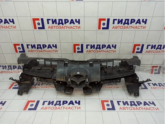 Кронштейн решетки радиатора Mazda 3 BCW8507M1F