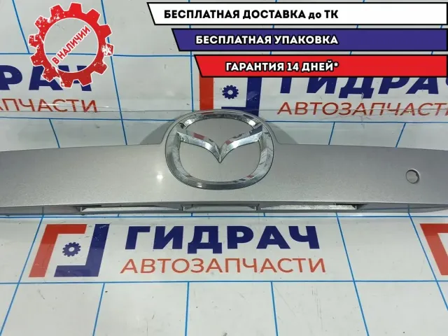 Накладка двери багажника Mazda CX-7 EG24-50-810E-06. Дефект хрома.