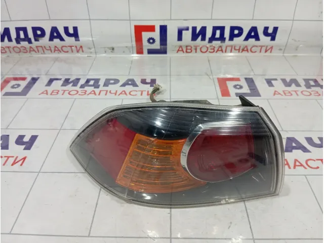 Фонарь задний наружный левый Mitsubishi Lancer 8330A623