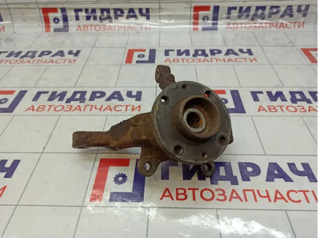 Кулак поворотный передний левый Nissan Note 40015AX600