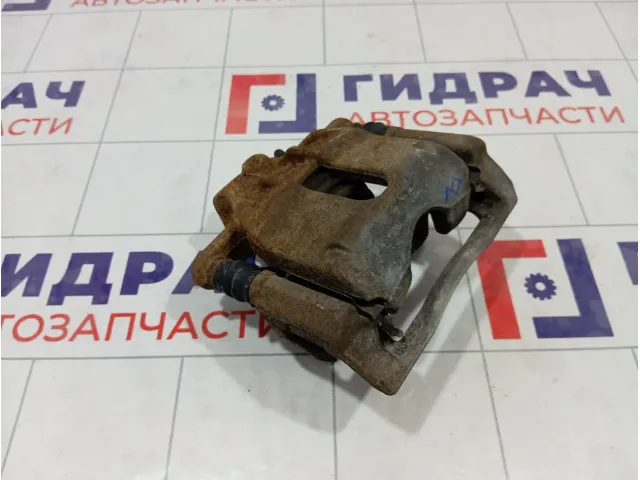 Суппорт тормозной передний левый Nissan Note 41011AX60A