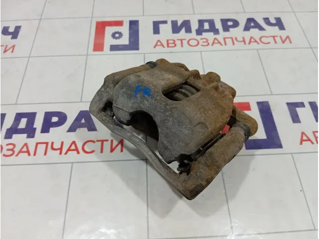 Суппорт тормозной передний правый Nissan Note 41001AX60A