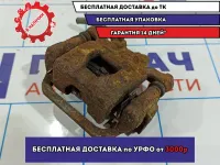 Суппорт тормозной задний левый Nissan Tiida 44011-EM11A.