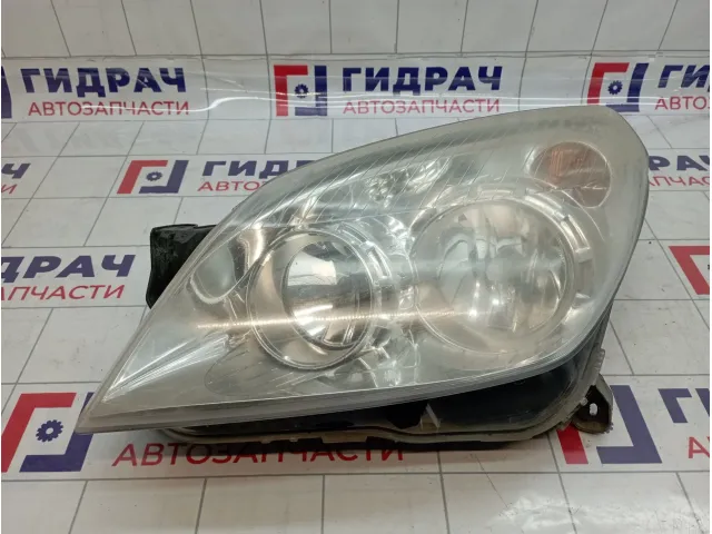 Фара левая Opel Astra H 1216659