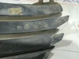 Заглушка бампера передняя левая Opel Astra 13110334