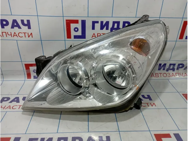 Фара левая Opel Astra (H) 1216659