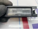 Фонарь подсветки номера Opel Corsa D 13251936