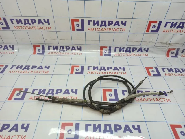 Трос стояночного тормоза Opel Corsa D