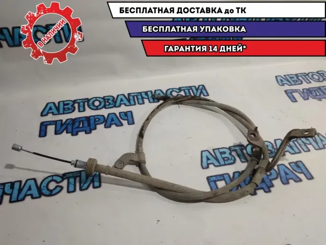 Трос стояночного тормоза левый Kia Rio 3 597601R300.