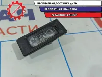 Фонарь подсветки номера Skoda Rapid 5NA943021.