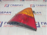 Фонарь задний наружный левый Suzuki Liana 3567055G00