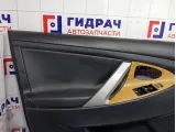 Обшивка двери передней левой Toyota Camry 6762033B00B0