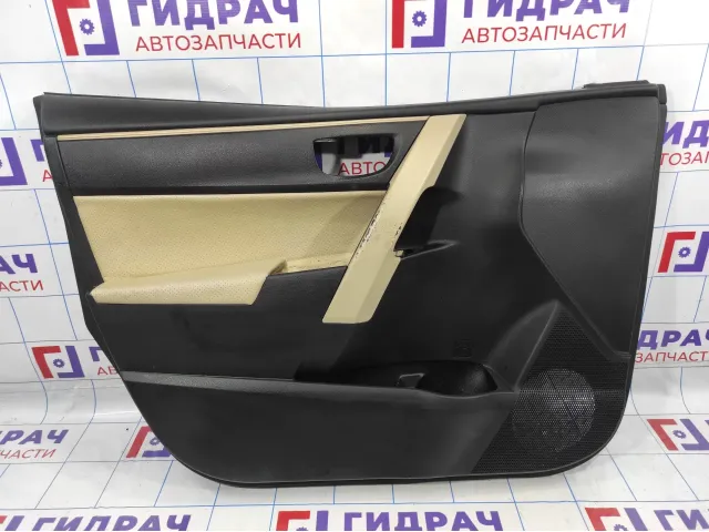 Обшивка двери передней левой Toyota Corolla (E180) 6762002R40. Перетянута в светлый.