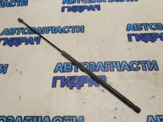 Амортизатор капота VW Golf 2011 5K0823359D