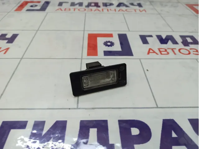 Фонарь подсветки номера Volkswagen Passat 8T0943021