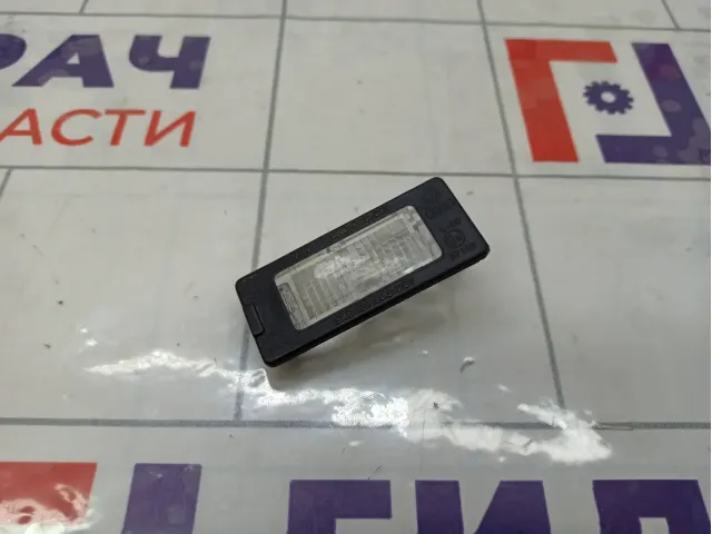 Фонарь подсветки номера Volkswagen Polo 5N0943021