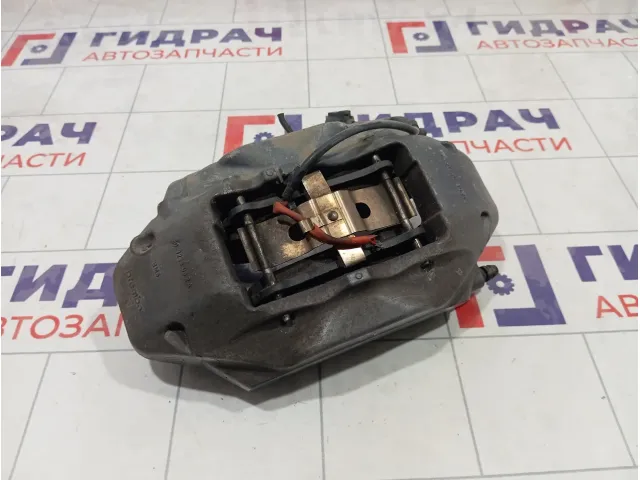 Суппорт тормозной передний левый Volkswagen Touareg 7L6615123R