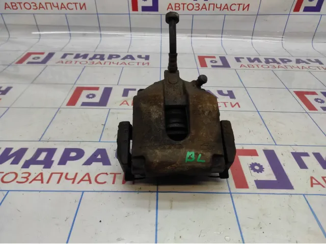 Суппорт тормозной задний левый Volvo XC90 8602854.