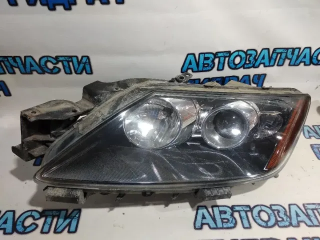 Фара левая Mazda CX-7 EH1051041A .