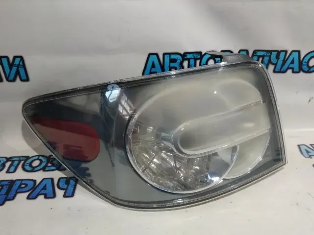 Фонарь задний левый Mazda CX-7 E22151180B.