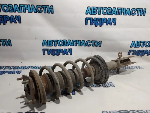 Амортизатор передний левый Mazda CX-7 EG2134900B .